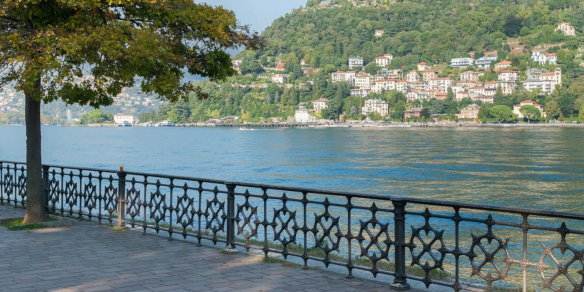 The vivid blue water and green shoreline of Lake Como