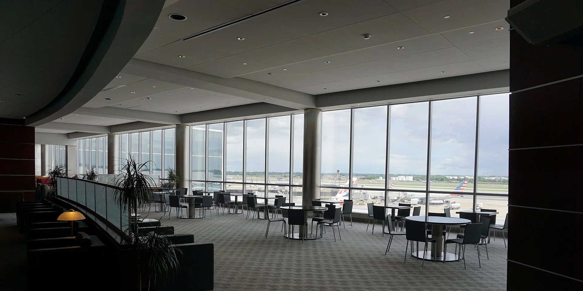 A quiet airport lounge overlooking the runway