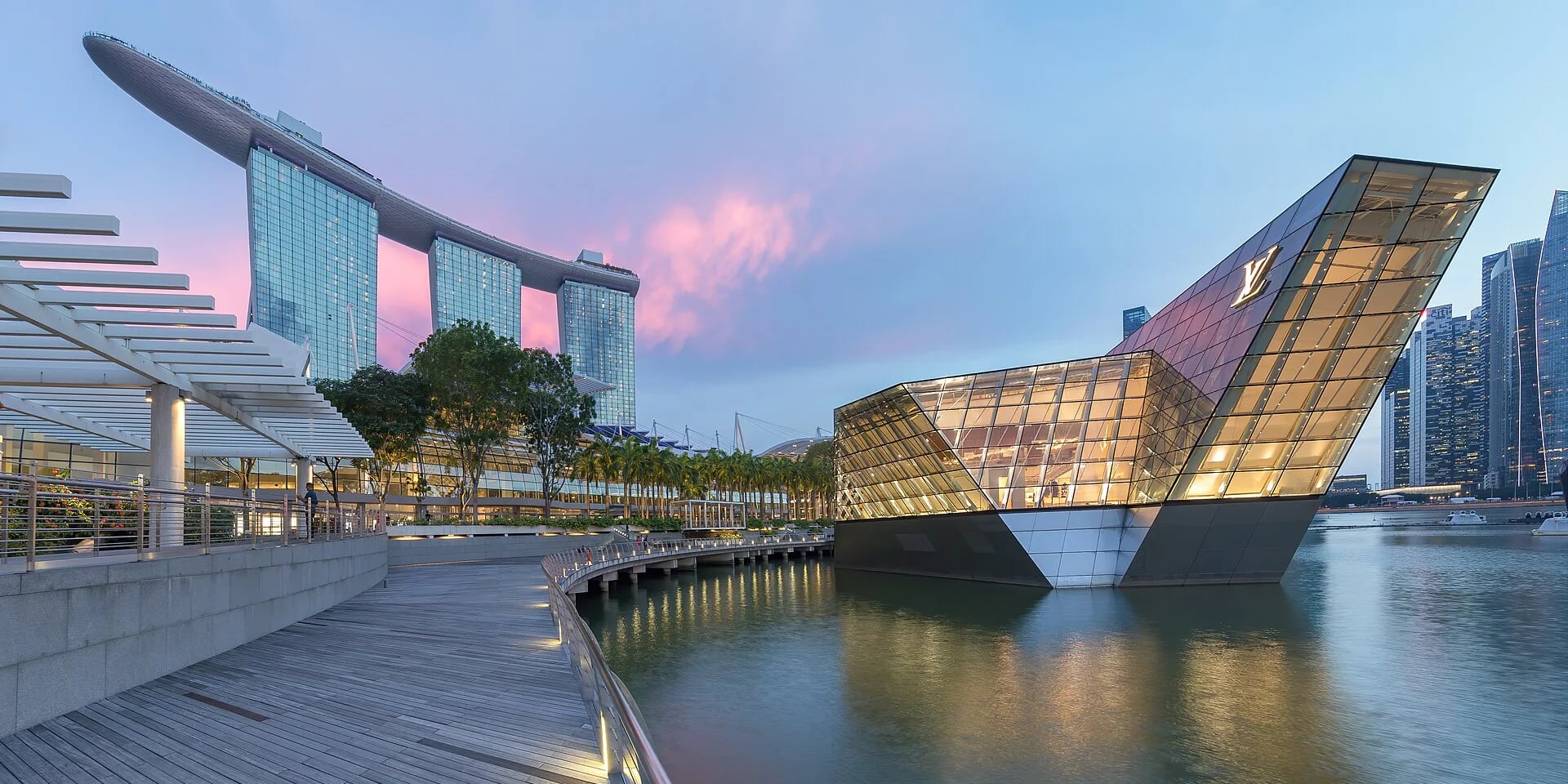 Marina Bay Sands reflected in the water beneath pink clouds